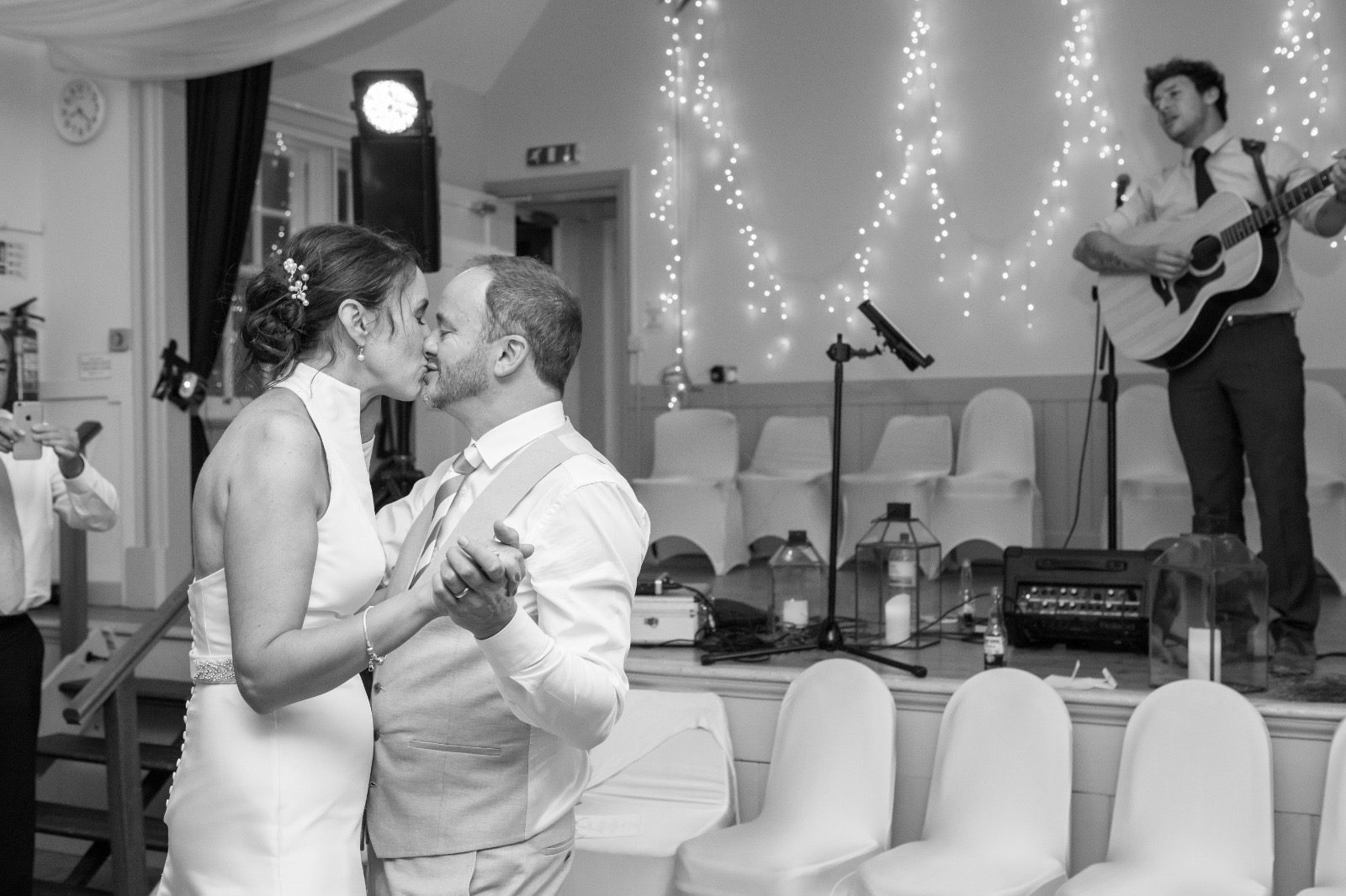 A couple's first dance while Aaron Norton plays live in the background