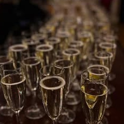 Rows of champagne glasses laid out for the MAMMA MIA! company party